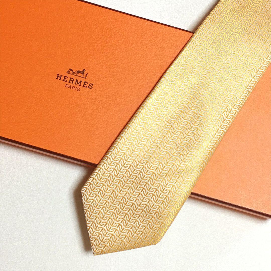 未使用級 エルメス HERMES ネクタイ シルク100% オレンジ系 総柄